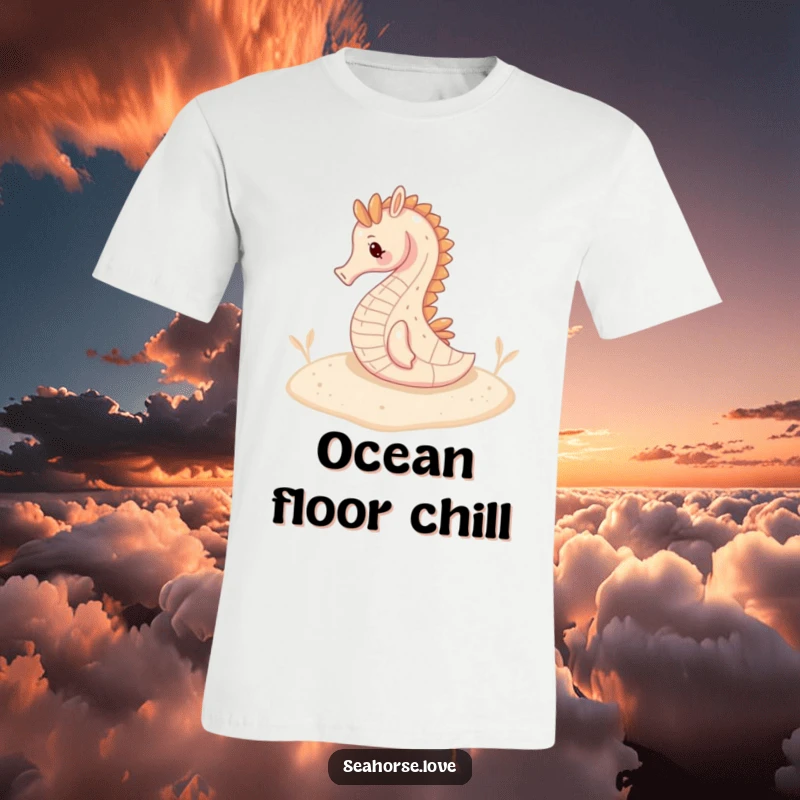 Funny t-shirt featuring a serene seahorse resting comfortably on a sandy seabed, embodying underwater peace.